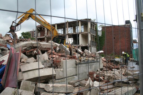 Remnants of Mary Monson Solicitors building (foreground).  Prepping ground for cherrypicker (background).